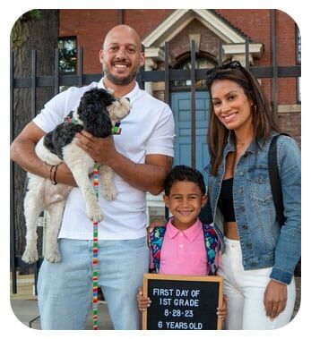 Parents and dog with Bennett Day School student in first grade