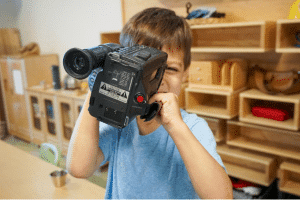 photo of student with video camera