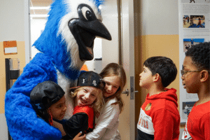 photo of students with school mascot