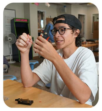 Bennett Day School Student with electronics in class
